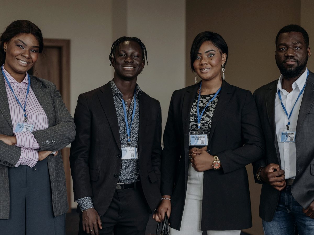 Teimetra team members in conversation at a business conference
